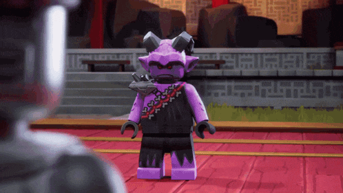 a purple lego figure with horns is standing on a red floor