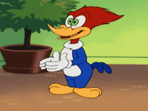 woody woodpecker giving a thumbs up in front of a plant