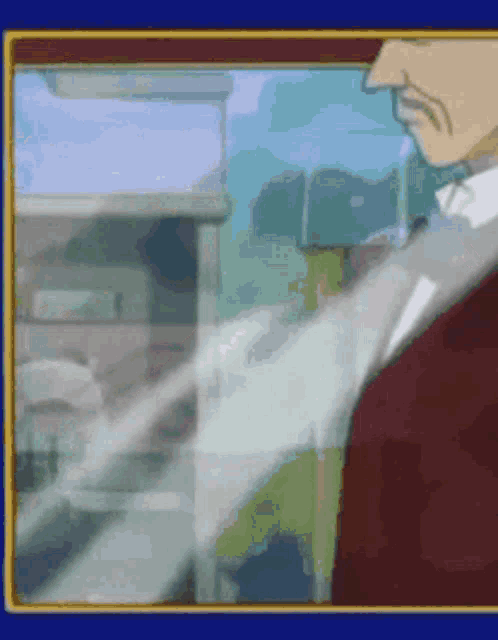 a man in a suit and tie is standing in front of a window
