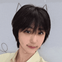 a close up of a woman 's face with a cat ear on her head