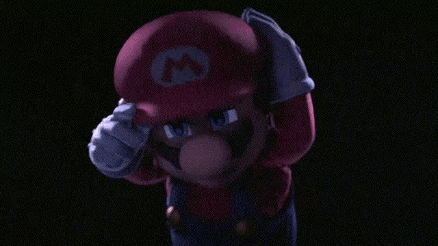 a close up of a mario cartoon character with a m on his hat
