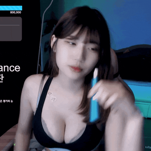 a woman is sitting in front of a screen that has the word ance on it