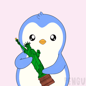 a penguin with a statue of liberty behind it