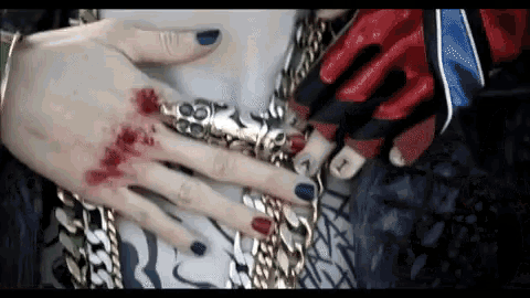 a close up of a person 's hand with blood coming out of it .