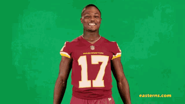 a man wearing a washington redskins jersey with the number 17