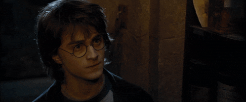 a close up of harry potter 's face with glasses