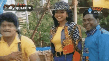 two men and a woman are standing next to each other and smiling . the woman is wearing a hat .