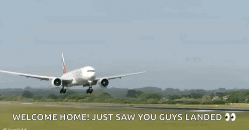 an emirates airplane is taking off from an airport