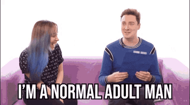 a man and a woman are sitting on a purple couch and the man is saying i 'm a normal adult man