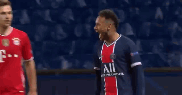 a soccer player wearing a neymar jr jersey is celebrating with his teammates on the field .