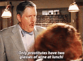 a man in a suit and bow tie says only prostitutes have two glasses of wine at lunch ..