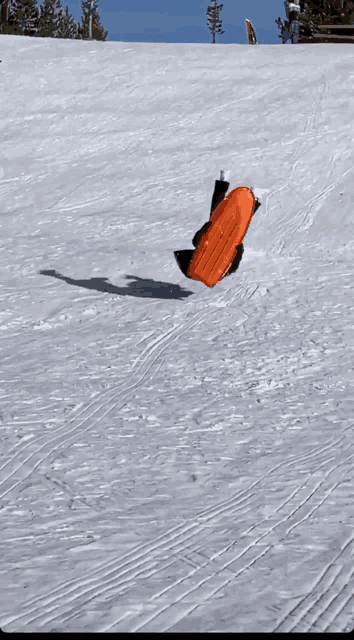 a person is doing a handstand in the snow