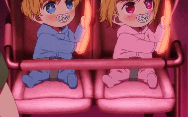 two babies are sitting next to each other in a pink stroller