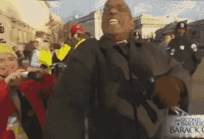 a man holding a sign that says the second inauguration