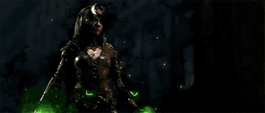 a woman in a costume is holding a green lightning bolt .