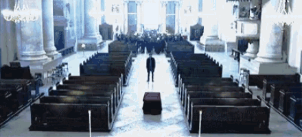 a man stands in the middle of a church