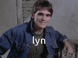 a young man in a denim jacket with the name lyn written on it