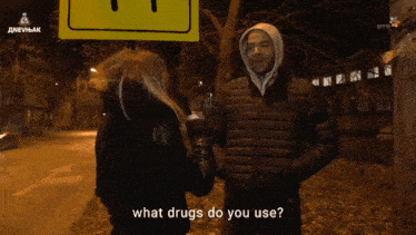 a woman asks a man what drugs do you use in front of a sign that says dnevnik