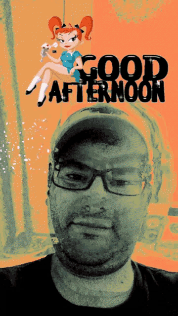 a man wearing glasses stands in front of a good afternoon poster