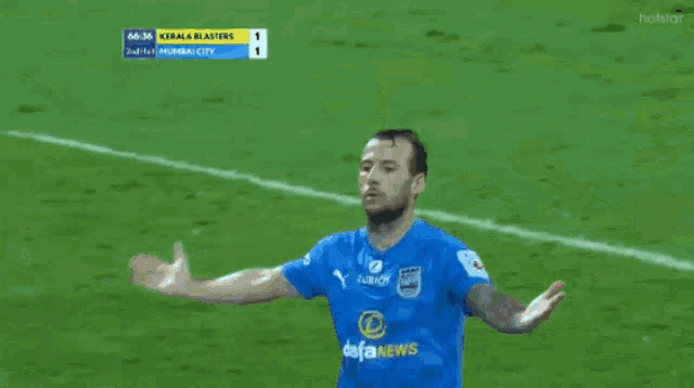 a kerala blasters soccer player is hugging another player on the field