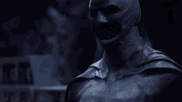 a close up of a man in a batman suit