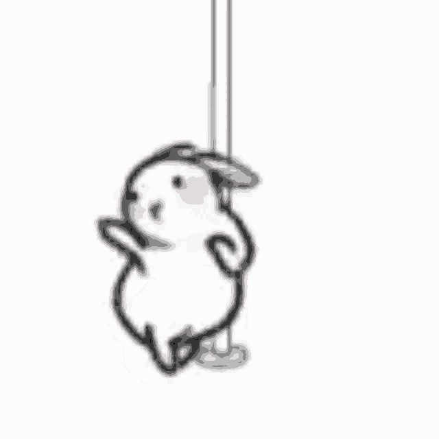 a rabbit is hanging from a string on a string .