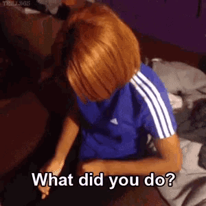 a woman in a blue adidas shirt is laying on a bed asking what did you do