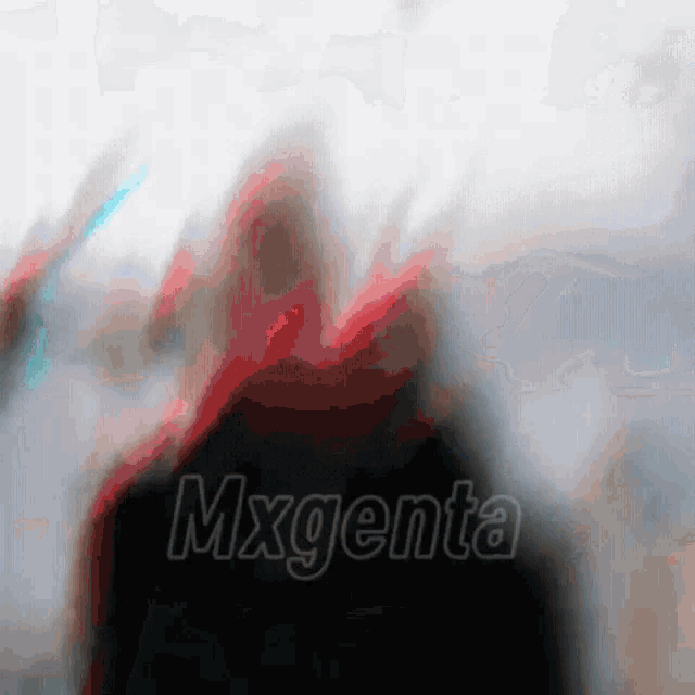 a blurry picture of a person with the word magenta on the bottom right