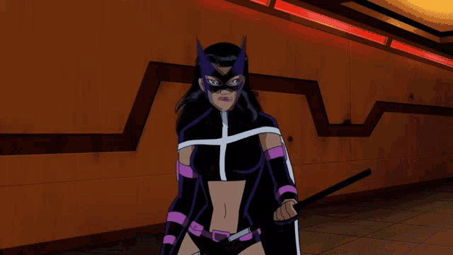 a man in a purple helmet and a woman in a black and purple outfit are standing next to each other