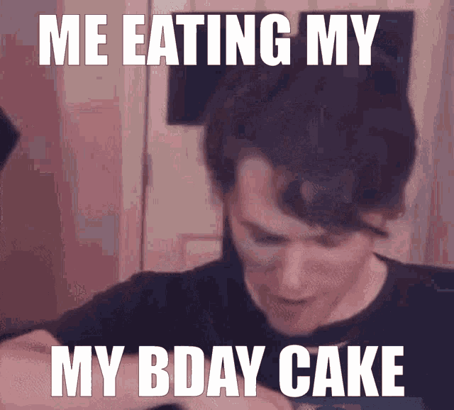 a man in a black shirt is eating a bday cake