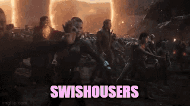 a group of people are dancing in front of a fire and the words swishousers are written on the screen .