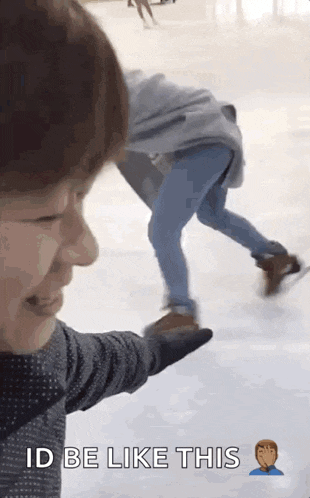 a man is pointing at a person on the ice and says id be like this .