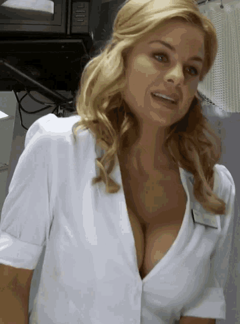 a woman in a white shirt with a name tag that says ' amanda ' on it