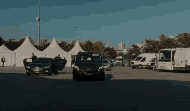 a black mercedes van with a license plate that says tk - x - 1109