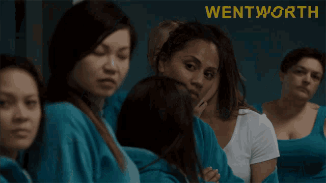 a group of women standing next to each other with the word wentworth in the corner