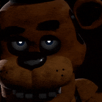 a close up of a teddy bear with blue eyes and a purple tongue sticking out