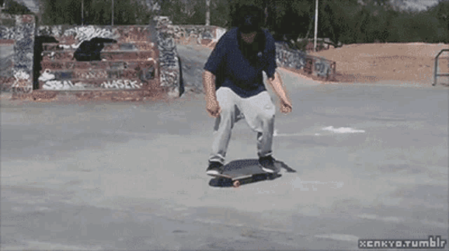 a skateboarder is doing a trick in a skate park with a watermark that says xenkyo.tumblr