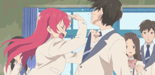 a girl with red hair is slapping a boy in a school uniform