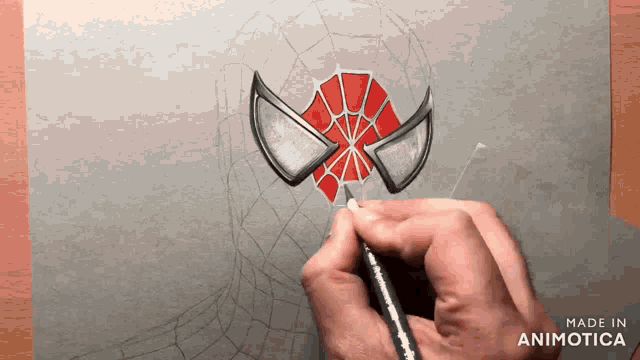 a person is drawing a spider man face with a pencil and the words made in animotica below it