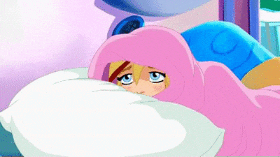 a cartoon girl is laying in bed with a pink blanket covering her head .