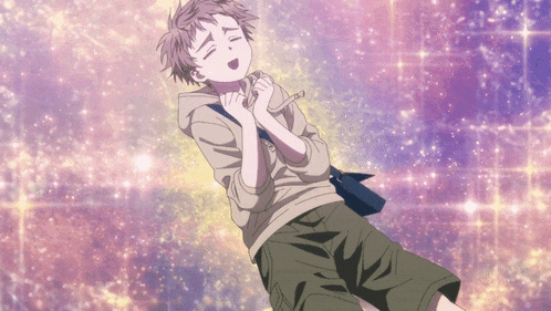 a boy with a hoodie and shorts is laying on the ground