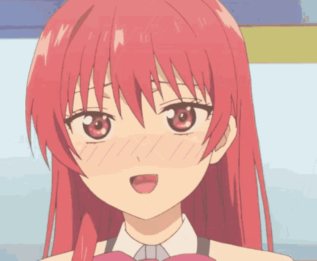 a close up of a girl with red hair and red eyes