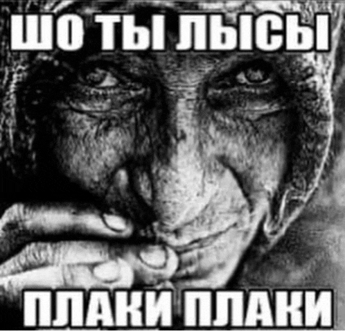 a black and white photo of an elderly woman with russian writing on it