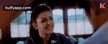 a man and a woman are talking to each other and the woman is saying `` chi '' .