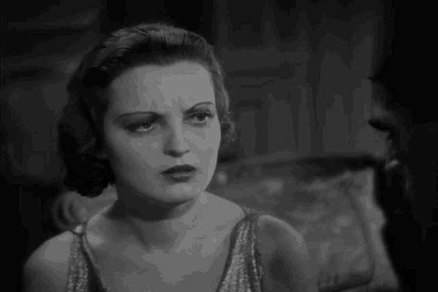 a black and white photo of a woman 's face