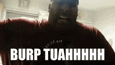 a man in a red shirt is making a funny face with the words burp tuahhhh written on the screen .