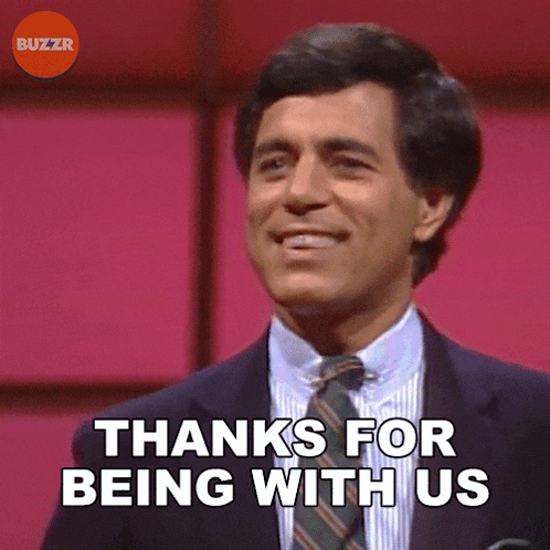 a man in a suit and tie is smiling and saying thanks for being with us