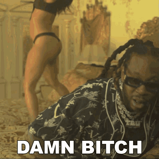 a man laying on a bed with the words damn bitch written above him