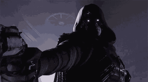 a hooded figure with glowing eyes holds a gun in a dark room