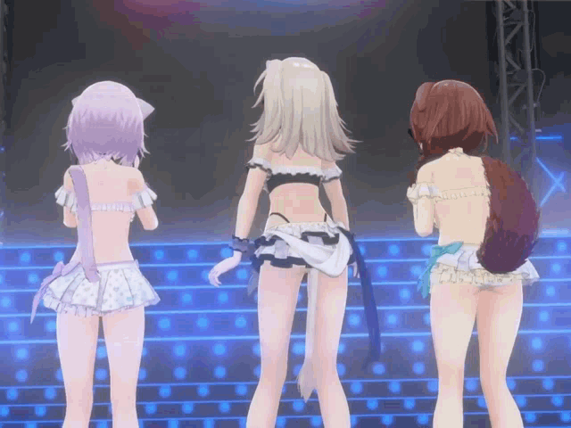 three anime girls are standing on a stage and one of them has a tail